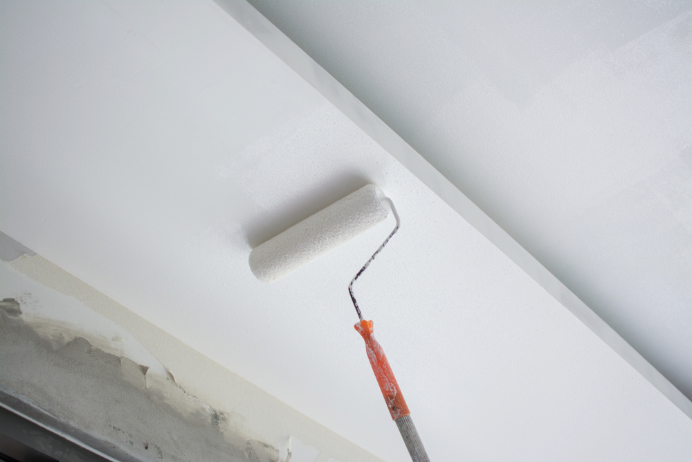 Painting,A,White,Gypsum,Plaster,Ceiling,With,Paint,Roller